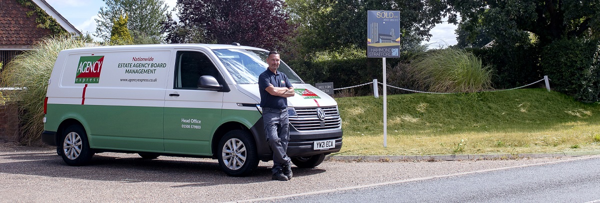Agency Express franchisee standing infront of van