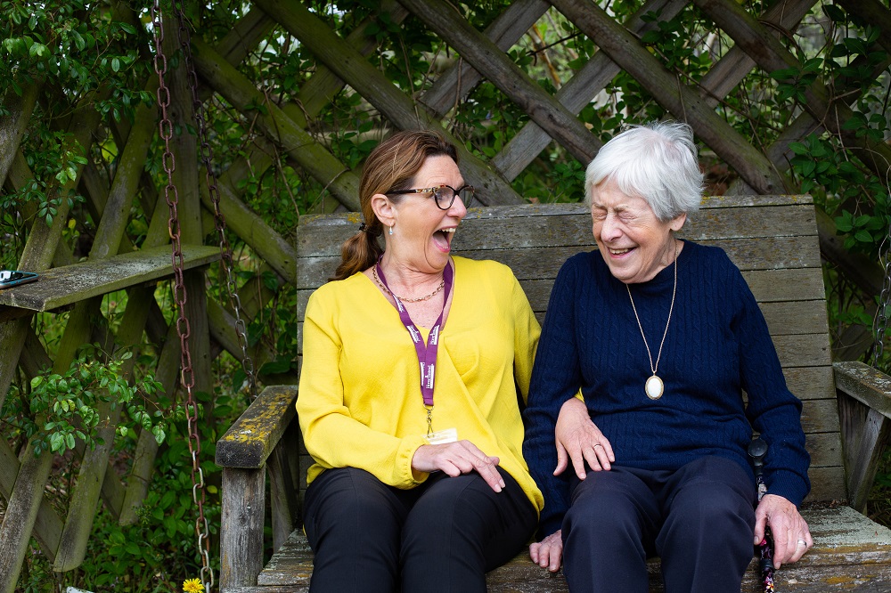 Home Instead caregiver with client