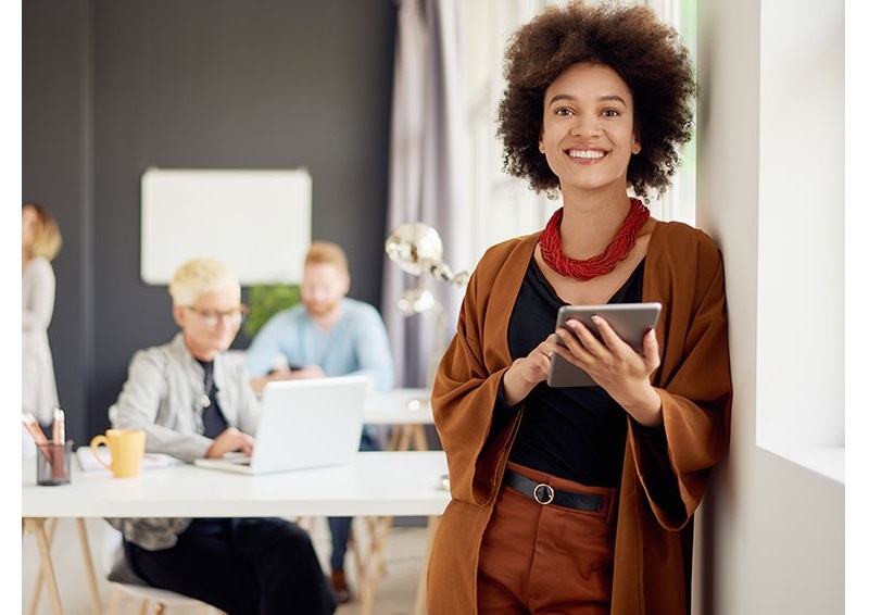 Lady with an afro using a tablet computer