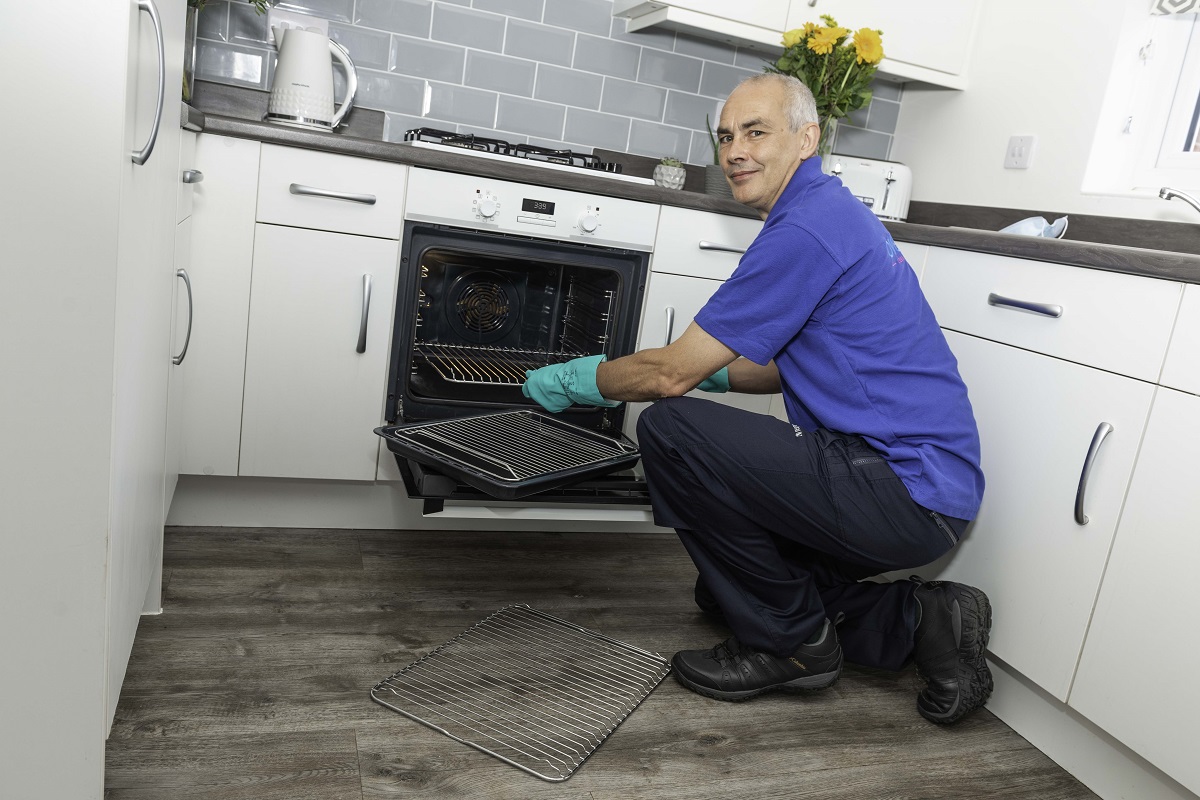 ovenclean franchisee cleaning an oven