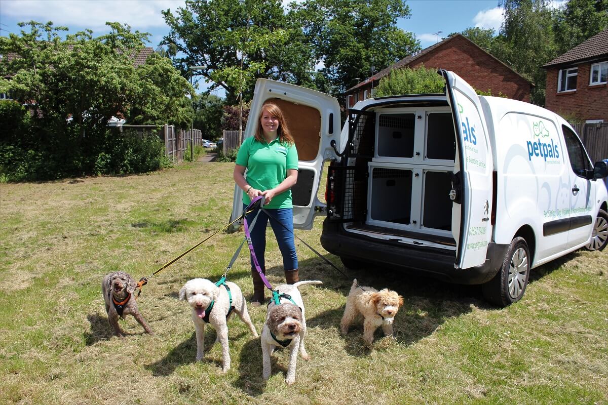 Petpals franchisee with dogs outside a van