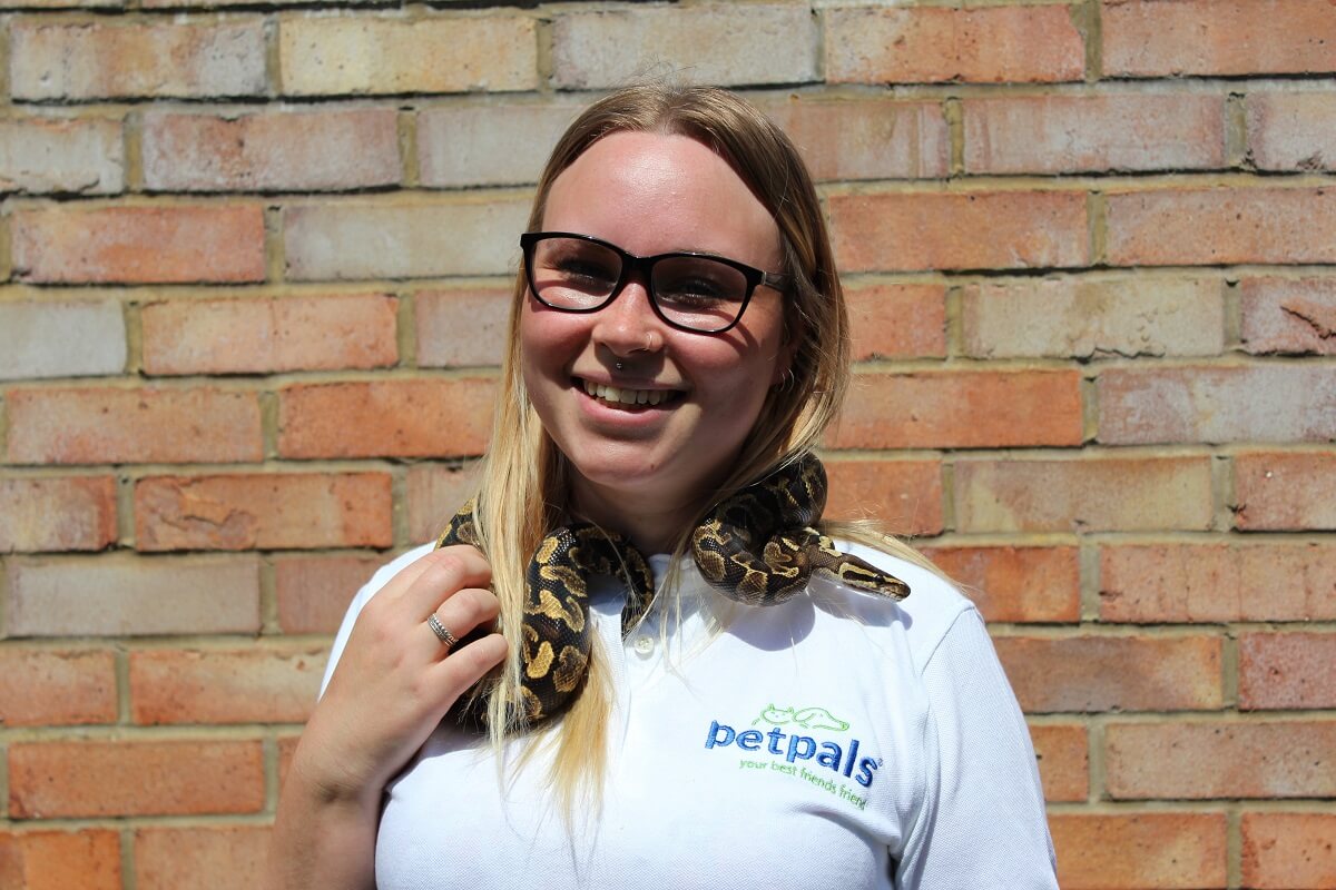 Petpals franchisees with snake wrapped around her neck