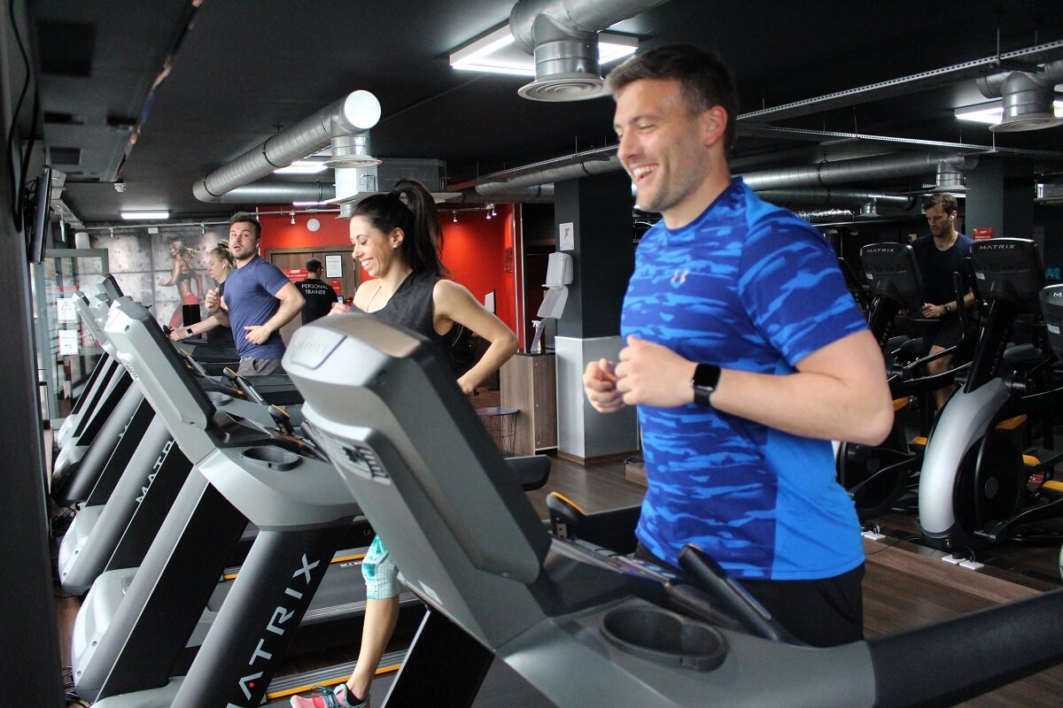 Man on treadmill inside a snap fitness gym