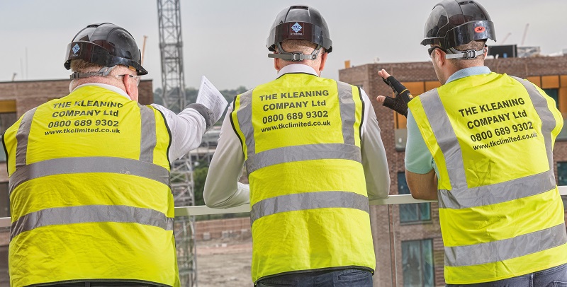 The Kleaning Company team discussing a project onsite