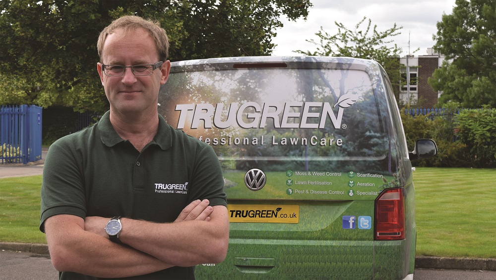 trugreen franchisee Dan next to Van