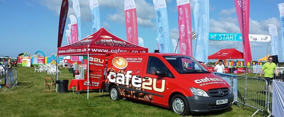 cafe2u franchisees next to van