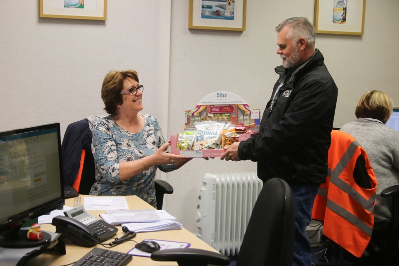 charisnack franchisee giving box to client