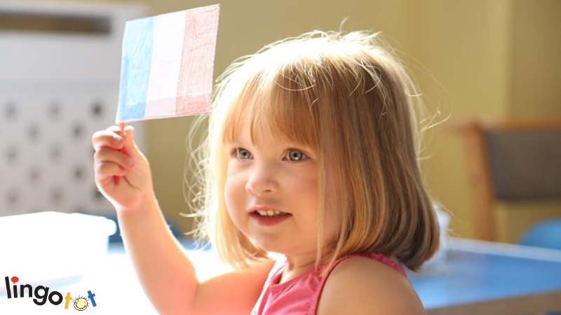 girl in lingotot class with flag