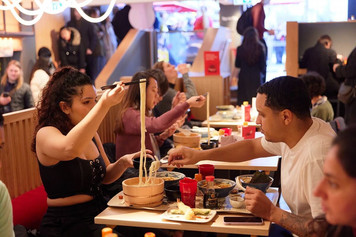 Customers inside a Marugame Udon Restaurant