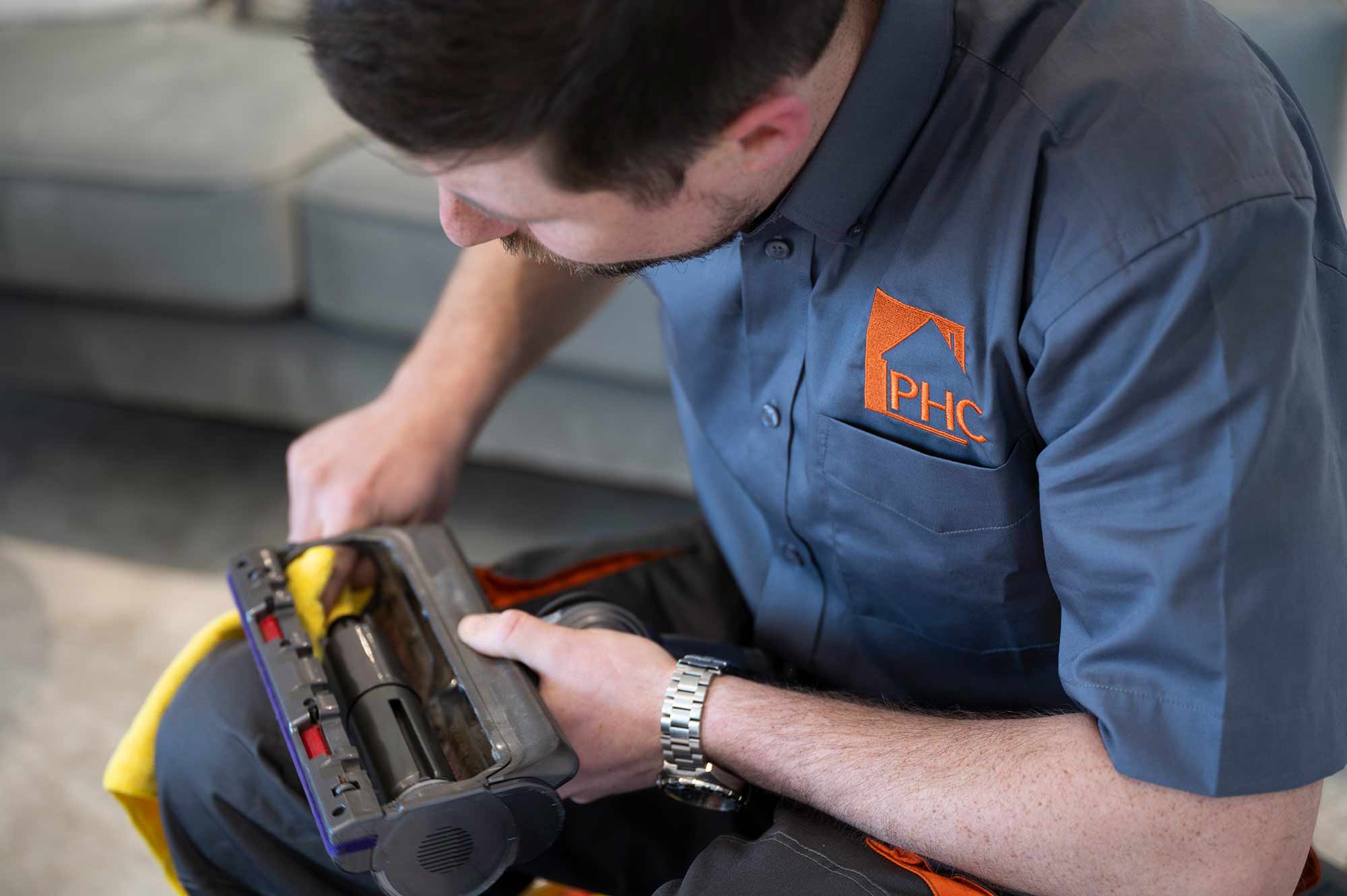 phc technician fixing vacuum